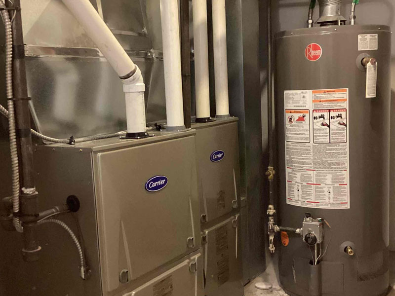 Carrier gas furnace and Rheem water heater installed in a home in Edmonton, AB