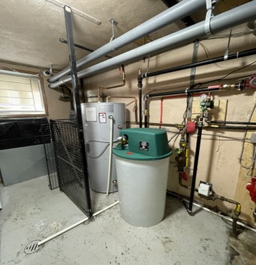 Servicing a water softener by Hydro-Flo Plumbing & Heating
