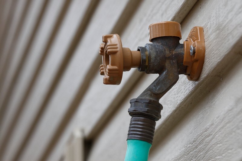 An outdoor hose bib in Edmonton by Hydro-Flo Plumbing & Heating