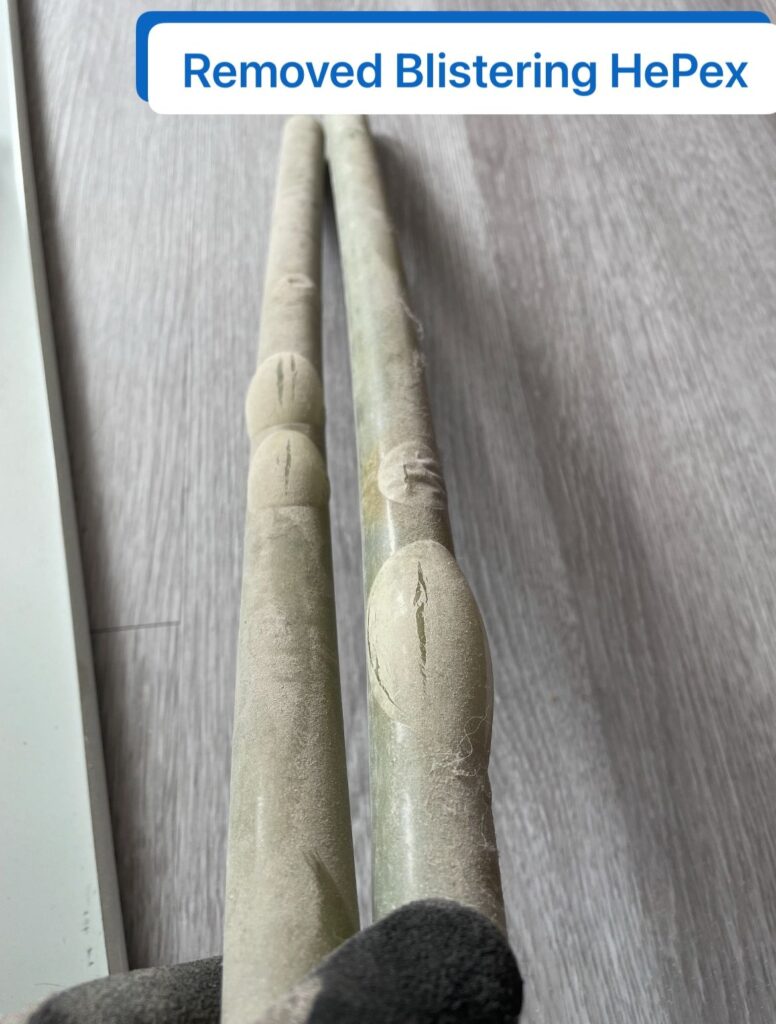 Comparison of intact and blistered HePex piping in high-rise hydronic heating system