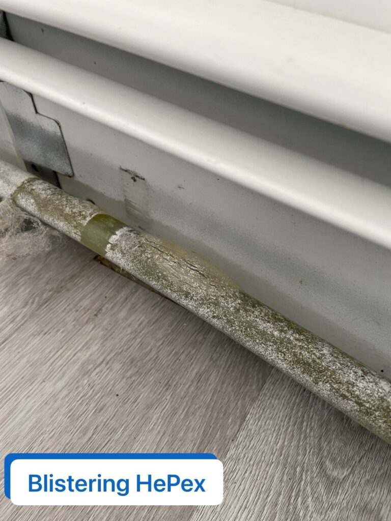 Multiple sections of removed blistered PEX piping from commercial high-rise boiler system