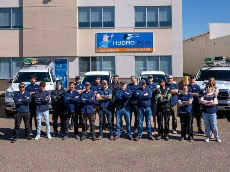 A group of Hydro Flo Employees standing in front of a building in Edmonton, AB