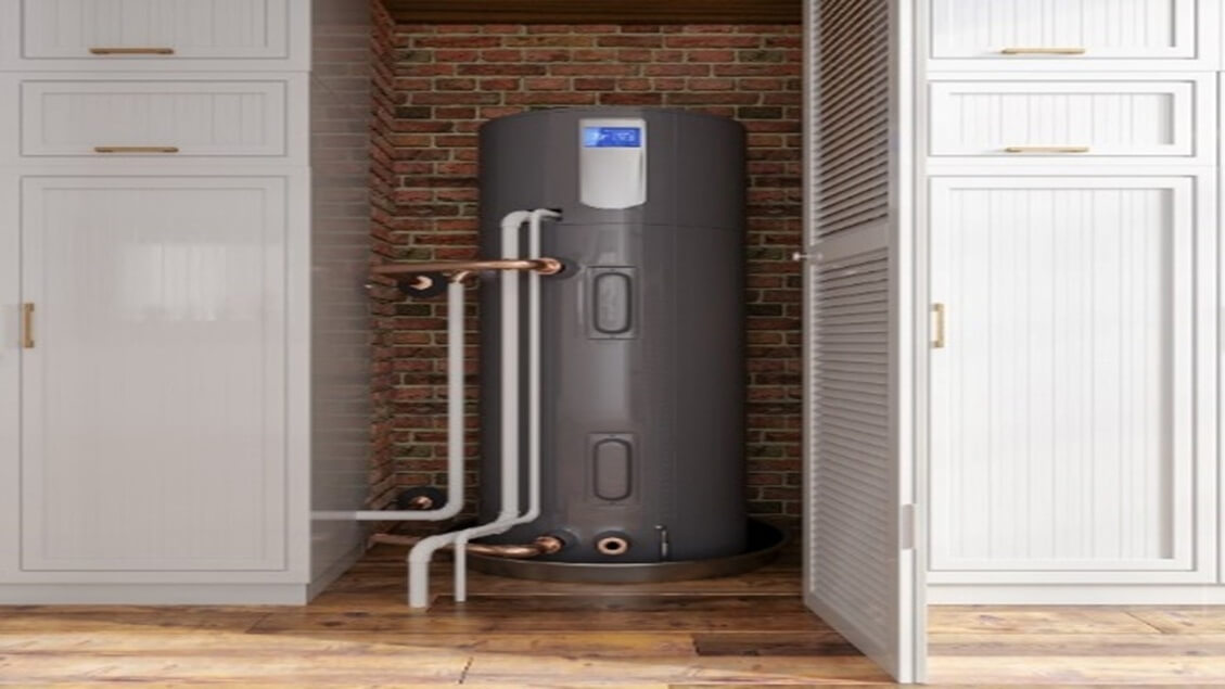 Grey water heater tank installed against a brick wall