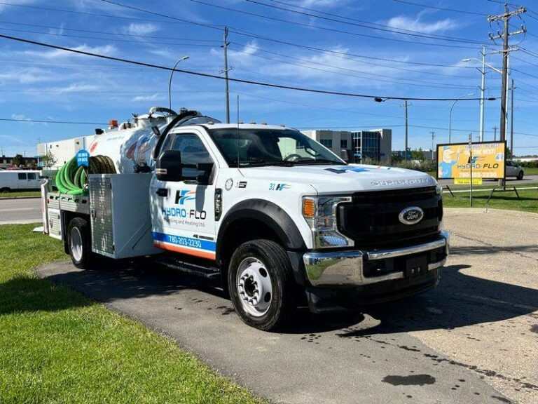A white truck showcasing reliable sump pump replacement solutions in Edmonton, AB